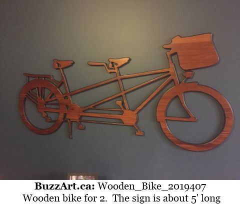 Wooden bike for 2.  The sign is about 5' long